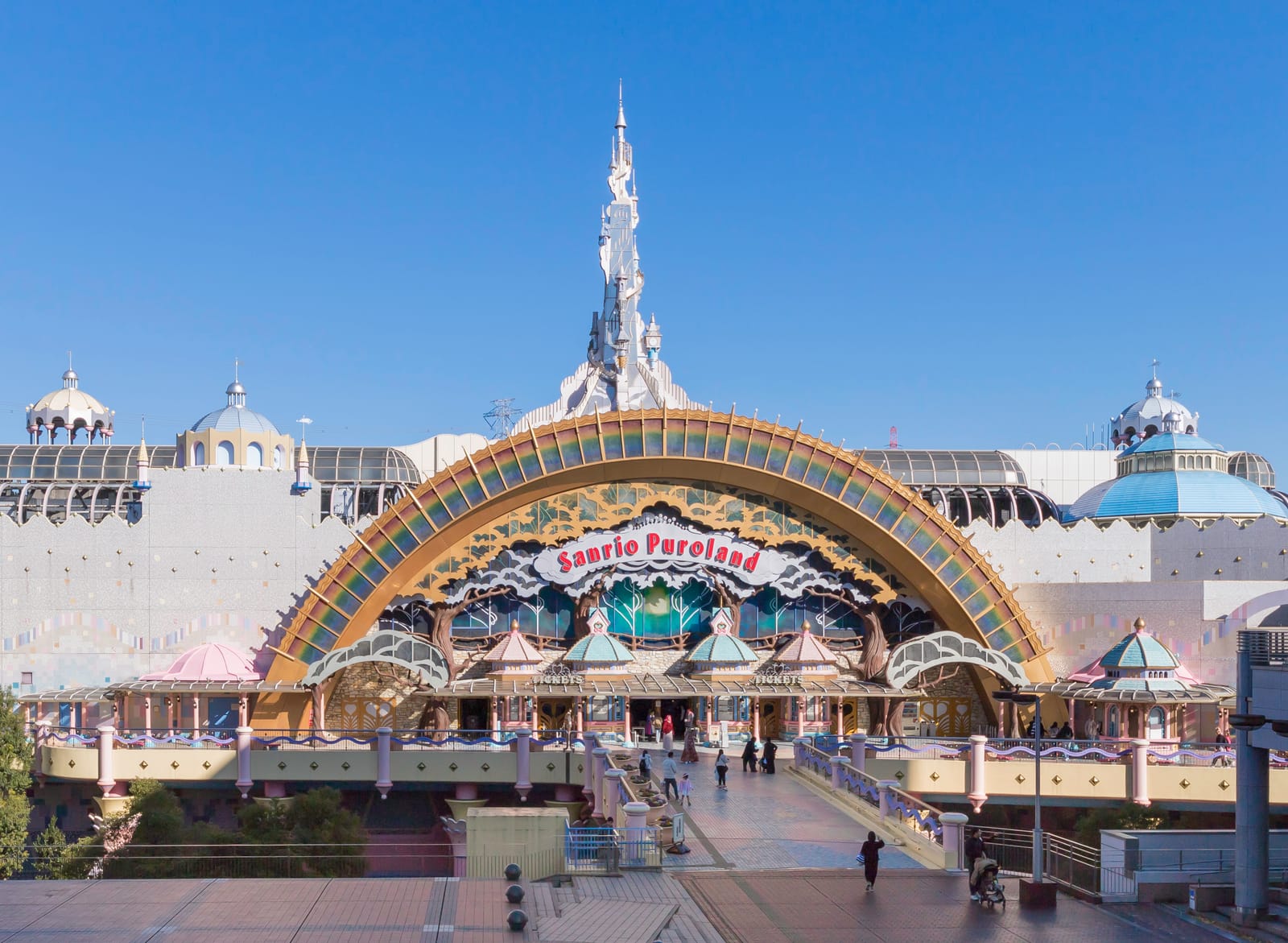 Sanrio Puroland's rainbow-arched entrance and the open plaza in front of it